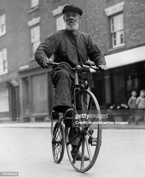 Mr. A.I. White, 82 years old, and his boneshaker, which he built in 1871 as the second one in the whole country. Photograph. 16.5.1935. (Photo by...