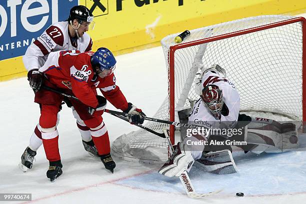 Jaromir Jagr of Czech Republic tries to score against Sergejs Pecura and goalkeeper Edgars Masalskis of Latvia during the IIHF World Championship...