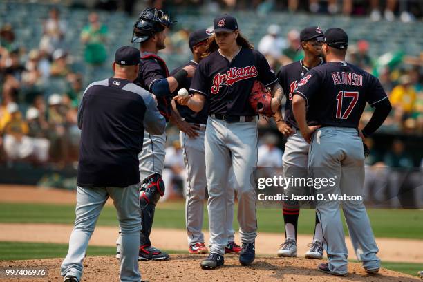 Mike Clevinger of the Cleveland Indians is relieved by manager Terry Francona during the seventh inning against the Oakland Athletics at the Oakland...