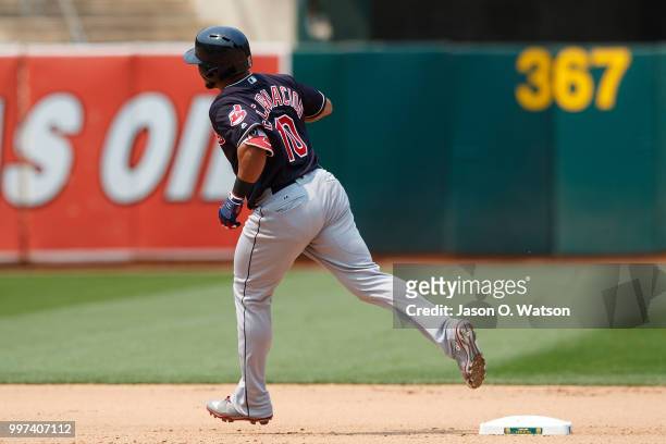 Edwin Encarnacion of the Cleveland Indians rounds the bases after hitting a home run against the Oakland Athletics during the seventh inning at the...
