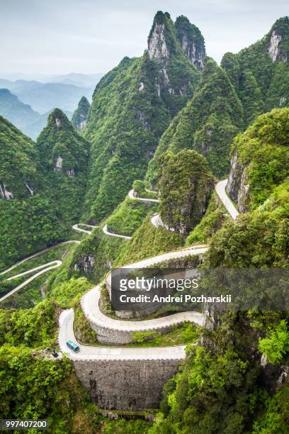 china, mount tianmen shan, serpentine turns 99 - tianmen stock pictures, royalty-free photos & images