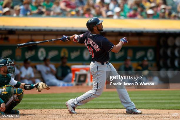 Edwin Encarnacion of the Cleveland Indians hits a home run against the Oakland Athletics during the seventh inning at the Oakland Coliseum on July 1,...