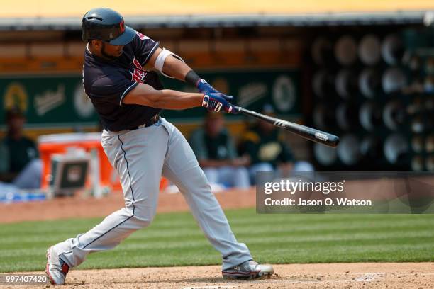 Edwin Encarnacion of the Cleveland Indians hits a home run against the Oakland Athletics during the seventh inning at the Oakland Coliseum on July 1,...