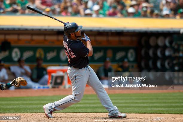 Edwin Encarnacion of the Cleveland Indians hits a home run against the Oakland Athletics during the seventh inning at the Oakland Coliseum on July 1,...