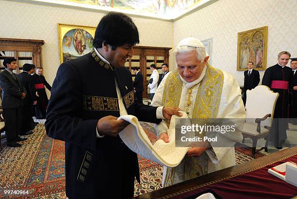 Pope Benedict XVI exchanges gifts with President of Bolivia Evo Morales during a meeting at the Vatican Library on May 17, 2010 in Vatican City,...