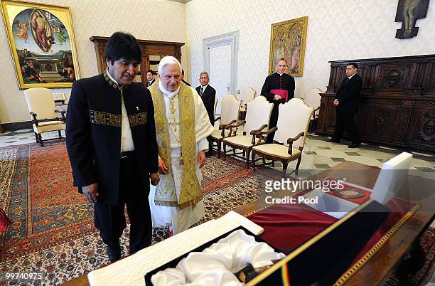 Pope Benedict XVI exchanges gifts with President of Bolivia Evo Morales during a meeting at the Vatican Library on May 17, 2010 in Vatican City,...