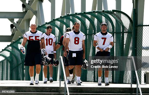 Quarterbacks Matt Schaub, John David Booty, Dan Orlovsky,Tyler Sheehan and center Chris Myers walk from Reliant Stadium to the practice facility for...