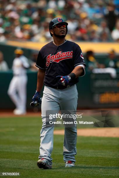 Edwin Encarnacion of the Cleveland Indians returns to the dugout after striking out against the Oakland Athletics during the fifth inning at the...