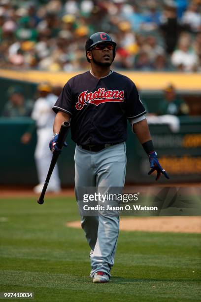 Edwin Encarnacion of the Cleveland Indians returns to the dugout after striking out against the Oakland Athletics during the fifth inning at the...