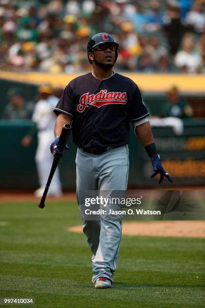 Edwin Encarnacion of the Cleveland Indians returns to the dugout after striking out against the Oakland Athletics during the fifth inning at the...