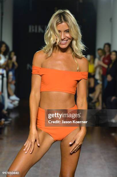 Model walks the runway for Bikini.com X newMARK Models during the Paraiso Fashion Fair at the Delano Hotel on July 12, 2018 in Miami, Florida.