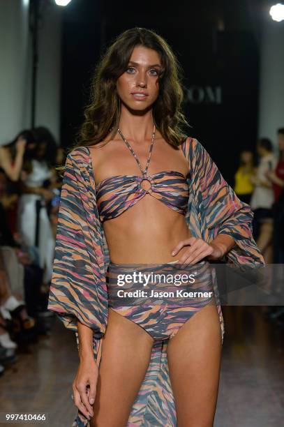 Model walks the runway for Bikini.com X newMARK Models during the Paraiso Fashion Fair at the Delano Hotel on July 12, 2018 in Miami, Florida.