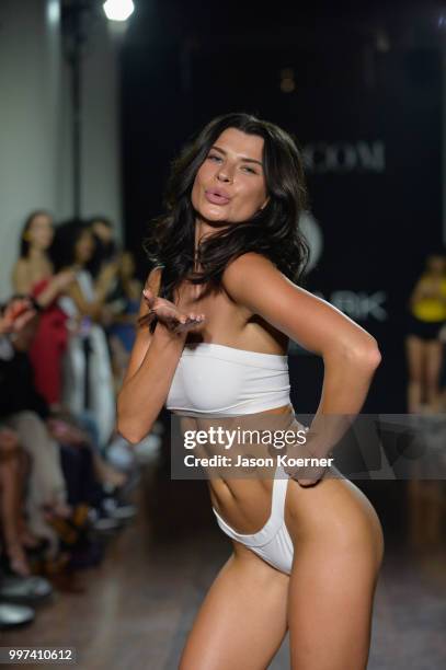 Model walks the runway for Bikini.com X newMARK Models during the Paraiso Fashion Fair at the Delano Hotel on July 12, 2018 in Miami, Florida.