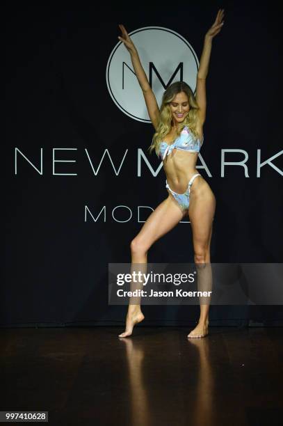 Model walks the runway for Bikini.com X newMARK Models during the Paraiso Fashion Fair at the Delano Hotel on July 12, 2018 in Miami, Florida.