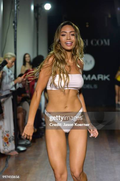 Model walks the runway for Bikini.com X newMARK Models during the Paraiso Fashion Fair at the Delano Hotel on July 12, 2018 in Miami, Florida.