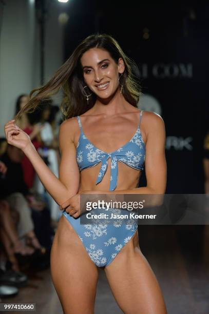 Model walks the runway for Bikini.com X newMARK Models during the Paraiso Fashion Fair at the Delano Hotel on July 12, 2018 in Miami, Florida.