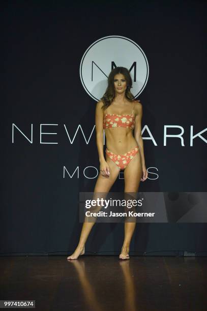 Model walks the runway for Bikini.com X newMARK Models during the Paraiso Fashion Fair at the Delano Hotel on July 12, 2018 in Miami, Florida.