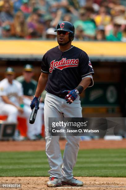Edwin Encarnacion of the Cleveland Indians reacts after striking out against the Oakland Athletics during the fifth inning at the Oakland Coliseum on...