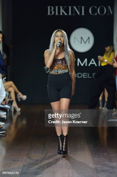 Kim Viera performs on the runway for Bikini.com X newMARK Models during the Paraiso Fashion Fair at the Delano Hotel on July 12, 2018 in Miami,...