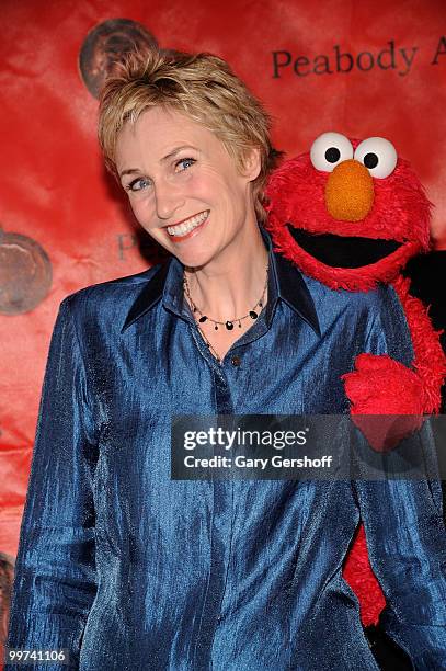 Actress Jane Lynch and Elmo attend the 69th Annual Peabody Awards at The Waldorf=Astoria on May 17, 2010 in New York City.