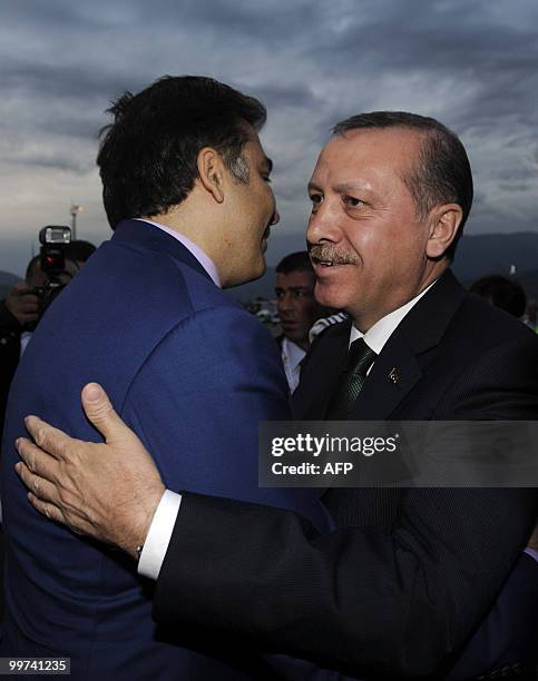 Georgia's President Mikheil Saakashvili greets Turkish Prime Minister Tayyip Erdogan ahead of their meeting in Batumi on May 17, 2010. AFP PHOTO /...