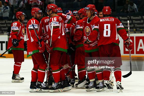 Players of Belarus celebrate after winning the IIHF World Championship qualification round match between Belarus and Denmark at Lanxess Arena on May...