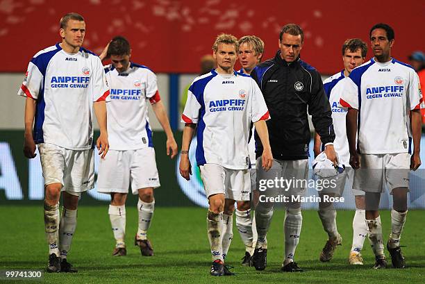 Players of Rostock look dejected after the Second Bundesliga play off leg two match between Hansa Rostock and FC Ingolstadt 04 at DKB Arena on May...