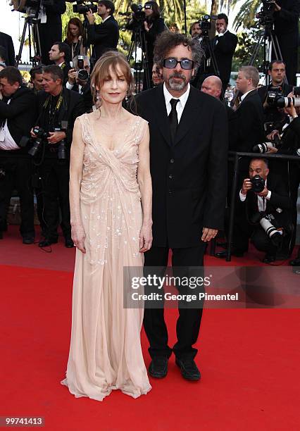 Actress Isabelle Huppert and director and president of the jury Tim Burton attend the premiere of 'Biutiful' held at the Palais des Festivals during...