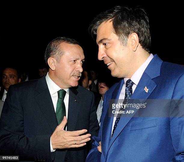 Georgia's President Mikheil Saakashvili confers with Turkish Prime Minister Tayyip Erdogan ahead of their meeting in Batumi on May 17, 2010. AFP...