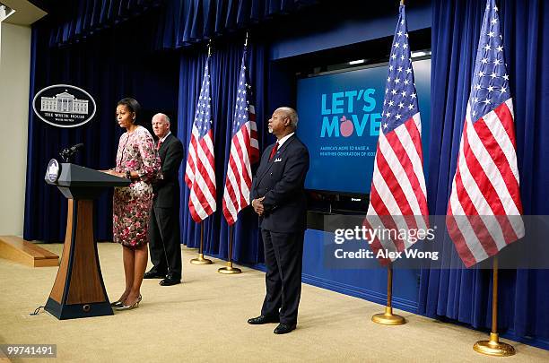 First lady Michelle Obama makes an announcement as David Mackay , chair of the Healthy Weight Commitment Foundation and CEO of the Kellogg Company,...