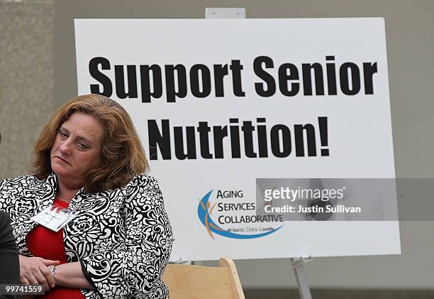 Woman looks on during a rally against budget cuts to senior programs at San Jose city hall May 17, 2010 in San Jose, California. Dozens of seniors...