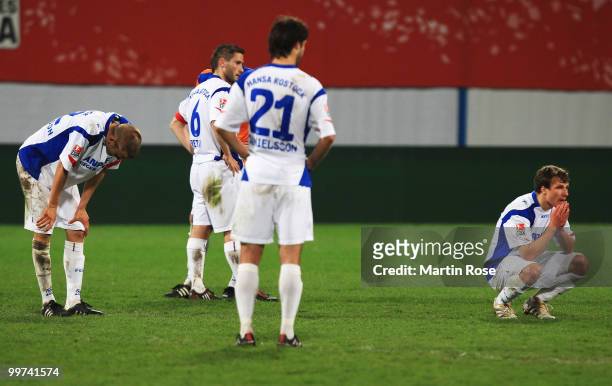 Players of Rostock look dejected after the Second Bundesliga play off leg two match between Hansa Rostock and FC Ingolstadt 04 at DKB Arena on May...