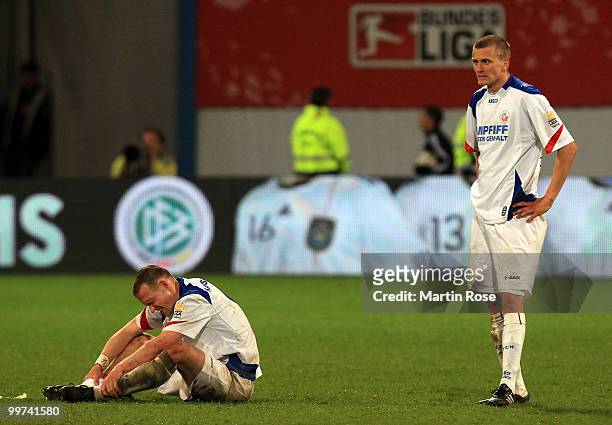 Enrico Kern and Andreas Dahlen of Rostock look dejected after the Second Bundesliga play off leg two match between Hansa Rostock and FC Ingolstadt 04...