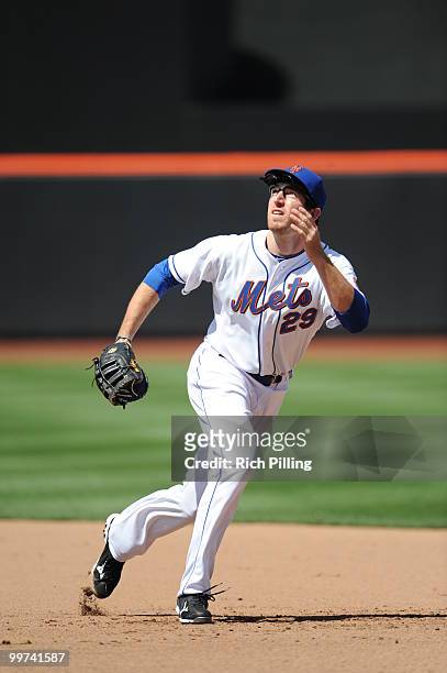 Ike Davis of the New York Mets fields during the extra inning game against the San Francisco Giants at Citi Field in Flushing, New York on May 8,...