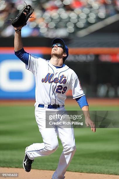 Ike Davis of the New York Mets fields during the extra inning game against the San Francisco Giants at Citi Field in Flushing, New York on May 8,...