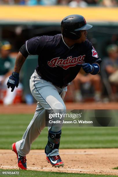 Jose Ramirez of the Cleveland Indians hits an RBI double against the Oakland Athletics during the fifth inning at the Oakland Coliseum on July 1,...