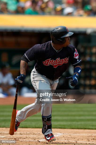 Jose Ramirez of the Cleveland Indians hits an RBI double against the Oakland Athletics during the fifth inning at the Oakland Coliseum on July 1,...