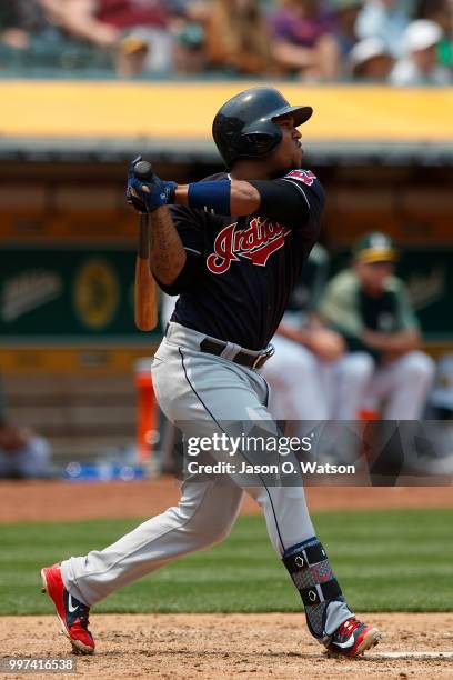 Jose Ramirez of the Cleveland Indians hits an RBI double against the Oakland Athletics during the fifth inning at the Oakland Coliseum on July 1,...