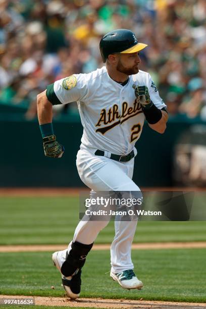 Jonathan Lucroy of the Oakland Athletics runs to first base after hitting an RBI single against the Cleveland Indians during the seventh inning at...