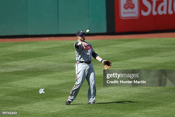 Left fielder Eric Hinske of the Atlanta Braves throws to second base during a game against the Philadelphia Phillies at Citizens Bank Park on May 8,...