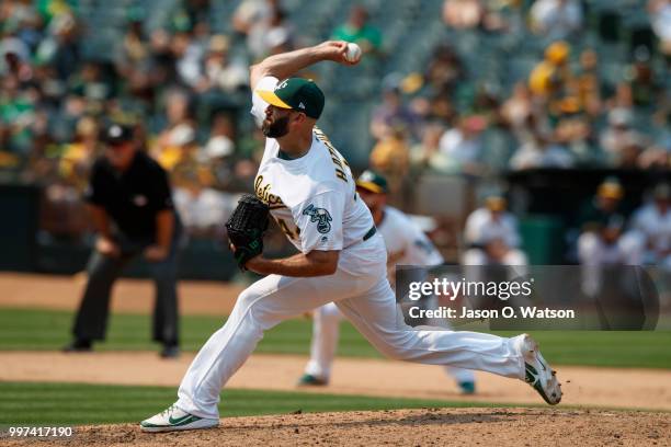 Chris Hatcher of the Oakland Athletics pitches against the Cleveland Indians during the eighth inning at the Oakland Coliseum on July 1, 2018 in...