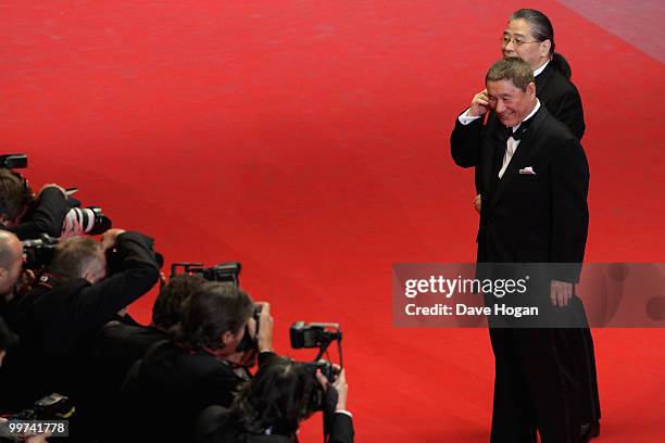 Director Takeshi Kitano and Masayuki Mori attend "Outrage" Premiere at the Palais des Festivals during the 63rd Annual Cannes Film Festival on May...