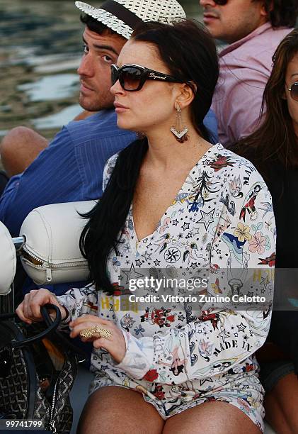 Actress Lindsay Lohan departs to attend Press Meeting aboard Lancia "Signora Del Vento" on May 17, 2010 in Cannes, France.