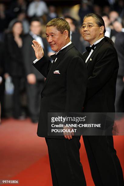 Japanese actor and director Takeshi Kitano and Japanese producer Masayuki Mori arrive for the screening of "Outrage" presented in competition at the...