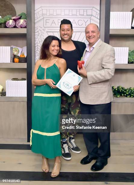 Renata Lopes-Merriam, Pietro Schumann and Philip Schumann attend the launch of Farmacy Kitchen Cookbook hosted by Vegan/Plant-based Author Camilla...