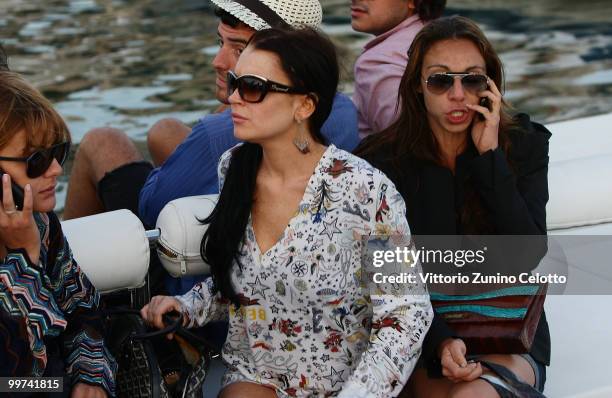 Actress Lindsay Lohan departs to attend Press Meeting aboard Lancia "Signora Del Vento" on May 17, 2010 in Cannes, France.