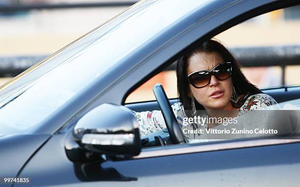 Actress Lindsay Lohan departs to attend Press Meeting aboard Lancia "Signora Del Vento" on May 17, 2010 in Cannes, France.