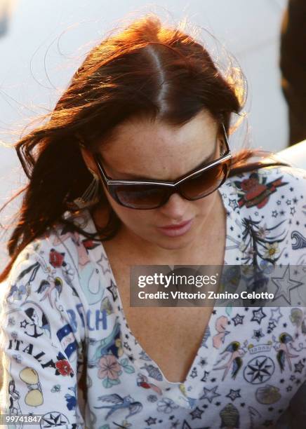 Actress Lindsay Lohan departs to attend Press Meeting aboard Lancia "Signora Del Vento" on May 17, 2010 in Cannes, France.