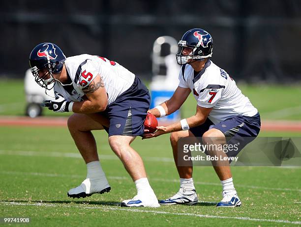 Quarterback Dan Orlovsky of the Houston Texans takes a snap from center Chris Myers during the first day of OTA's at Reliant Park on May 17, 2010 in...