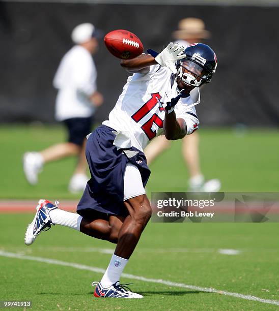 Wide receiver Jacoby Jones catches a pass during the first day of OTA's at Reliant Park on May 17, 2010 in Houston, Texas.